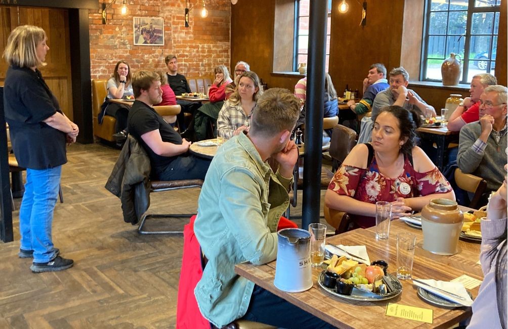 A cheese and cider tasting evening in the restaurant, boards and flagons on the tables